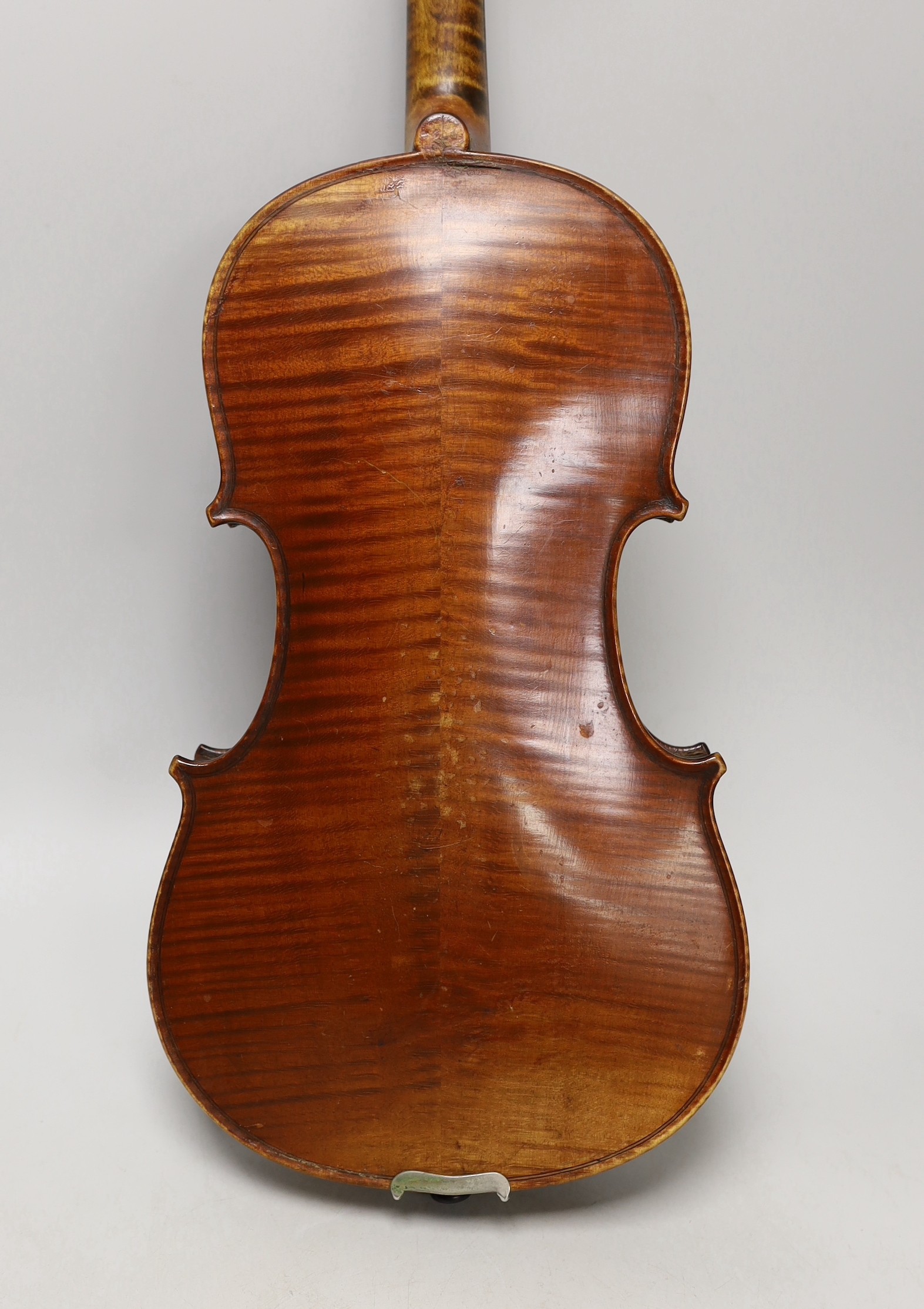 A cased French double backed violin, interior label reads ‘Copie de J.B. Vuillaume à Paris.’ Back measures 36cm excluding button